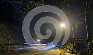 The night view of the pass road is full of fog with magical street lights