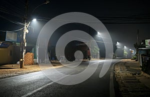 The night view of the pass road is full of fog with magical street lights