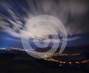 Night view of patronizing the city at the foot of the mountain. Brasov. Romania. Europe.