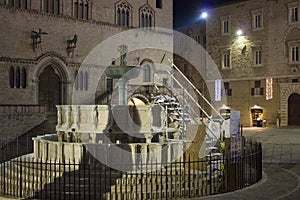 Night view of Perugia monumental fountain and Priori palace at night