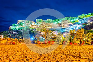 Night view of peschici town in Italy from an adjacent beach...IMAGE