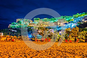 Night view of peschici town in Italy from an adjacent beach...IMAGE