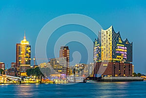 Night view of the port of hamburg with the elbphilharmonie building, Germany photo