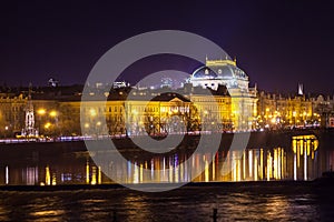 The night View on the Prague National Theater above the River Vltava, Czech Republic