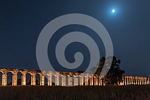 Night  view of the remains of an ancient Roman aqueduct located between Acre and Nahariya in Israel