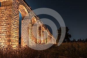 Night  view of the remains of an ancient Roman aqueduct located between Acre and Nahariya in Israel