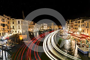 Night view from Rialto bridge to light trails on Grand Canal , Venice