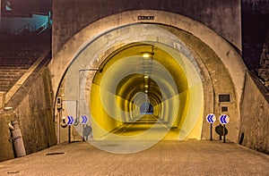 Night view of road tunnel, Japan. The Japanese text translates a