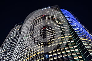Night view of the Roppongi Hills Mori Tower building in Tokyo, Japan photo