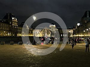 Night view of the Royal Palace and Louvre in Paris, France, Europe.