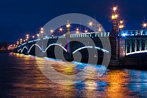 Night view in Saint Petersburg, the Trinity bridge and a beautiful reflection in the water