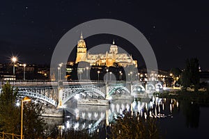 Night view of Salamanca Old and New Cathedrals from Enrique Esteban Bridge over Tormes River, Community of Castile and LeÃÂ³n,