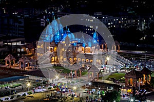 Night time lighting on Shree Swaminarayan temple at night, Pune, India. photo