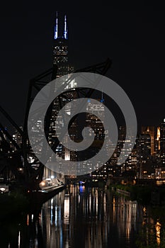 Night view of a sparkling Chicago Skyline with its reflection in the river