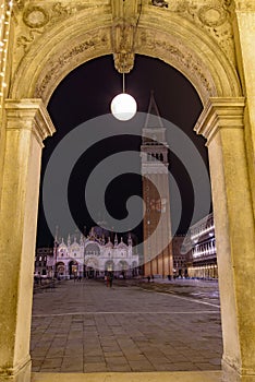 Night view of St Mark`s Square Piazza San Marco from an arch, Venice