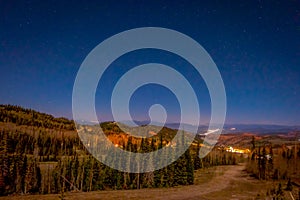 Night view of stars over the city in the horizont in Bryce Canyon National Park