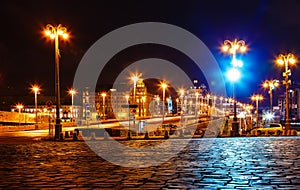 Night view with street lighting on the bridge leading to red square Moscow, Russia. The pavement in foreground.