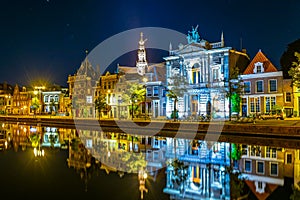 Night view of Teylers museum situated next to a channel in the dutch city Haarlem, Netherlands