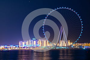 Night view to the Ain Dubai, giant Ferris at Bluewaters Island close to JBR beach.