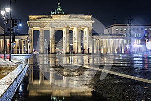 Night view to the Brandenburg Gate in Berlin, Germany, during a rainy winter evening