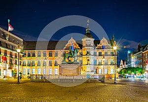 Night view of town hall in Dusseldorf and statue of an Wellem, Germany