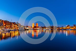 Night view of town hall in oslo viewed behind the port, Norway