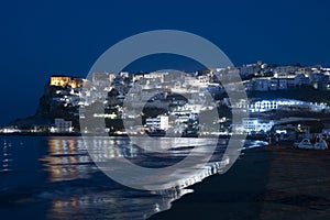Night view of the town of Peschici from the beach