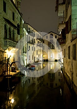 Night view of Treviso canal and buildings
