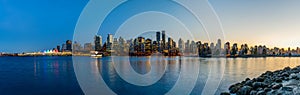 Night view of Vancouver downtown skyline panorama after sunset. British Columbia, Canada.