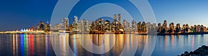 Night view of Vancouver downtown skyline panorama after sunset. British Columbia, Canada.