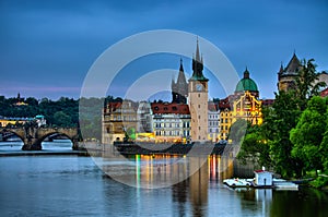 Night view on Vltava river, Charles Bridge and tower in Prague, Czech Republic