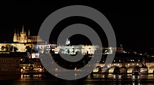 Night view from, the Vltava river in Prague, Hradcany Prague castle and the Charles bridge