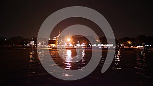 Night view of Wat Phrakeaw or the temple of the Emerald Buddha from Chao Phraya river in Bangkok