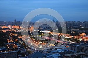 The night view of Xi`an city includes the Big Wild Goose Pagoda, urban tall buildings and ancient buildings.