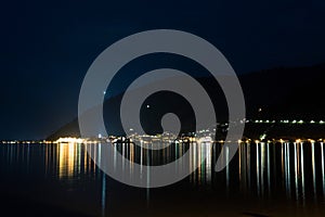 Night view on zeller lake at zell am see in Austria. city lights summer time copy space