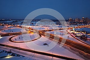 Night winter cityscape with big interchange