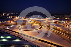 Night winter cityscape with big interchange