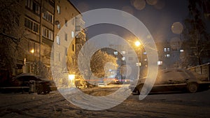 Night winter landscape in the alley of city street