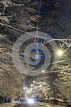 Night winter Lviv street and TV tower, Ukraine