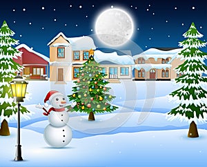 Night winter village landscape with snow covered house, christmas tree and snowman