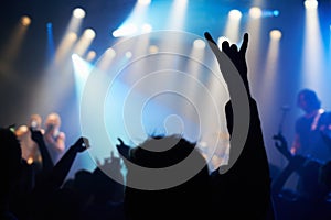 Nightclub, festival and audience with rock or silhouette for music, band and concert with spotlight, dancing or show