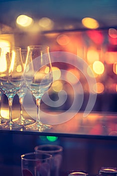 Nightlife: Wine glasses and colourful lights in a night club