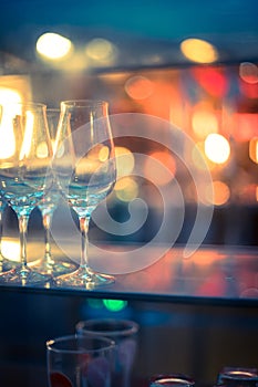 Nightlife: Wine glasses and colourful lights in a night club