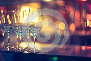 Nightlife: Wine glasses and colourful lights in a night club