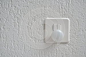 Nightlight and Light Switch on the wall photo