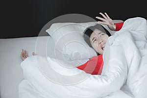 Nightmare or bad dream,Woman with scare and panic while lying down under the blanket in bedroom