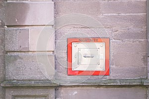 Nightsafe metal box in wall with red trim to keep one safe at night