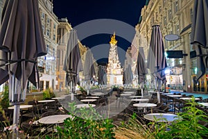 Nightscape of Graben street with street cafe and Plague Column, Austria, Vienna photo