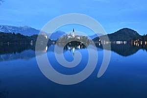 Nightscape of Lake Bled with Alps at background and blue water
