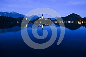 Nightscape of Lake Bled with Alps at background and blue water